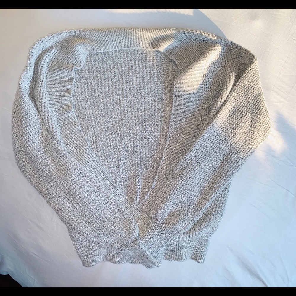 Light weight sweater with drop to waist neck.